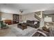 Comfortable living room with plush seating, piano, bookcase, and natural light at 10657 Medicine Bow St, Las Vegas, NV 89183