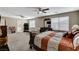 Expansive main bedroom with ceiling fans, multiple windows, and ample space for furniture and exercise equipment at 10657 Medicine Bow St, Las Vegas, NV 89183