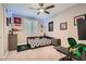Bright bedroom with a ceiling fan, sports decor, and a soccer ball themed comforter at 10936 White Alder Pl, Las Vegas, NV 89138