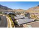 Stunning aerial view of a vibrant neighborhood nestled in the desert valley mountains at 11161 Black Fire Opal Dr, Las Vegas, NV 89138