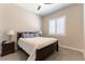 Cozy bedroom with plush carpeting, neutral walls, a queen-sized bed, and shuttered windows at 11161 Black Fire Opal Dr, Las Vegas, NV 89138