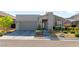 Charming single-story home featuring modern architectural details, desert landscaping, and a spacious two-car garage at 11161 Black Fire Opal Dr, Las Vegas, NV 89138