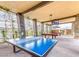Spacious recreation area featuring ping pong and pool tables, perfect for entertaining guests and enjoying leisure activities at 11161 Black Fire Opal Dr, Las Vegas, NV 89138