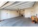 Spacious garage with epoxy flooring, overhead lighting, and ample space for parking and storage at 11161 Black Fire Opal Dr, Las Vegas, NV 89138