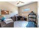 Bright home office featuring dual windows for natural light and an exercise area with a treadmill at 11161 Black Fire Opal Dr, Las Vegas, NV 89138