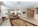 Bright open floorplan featuring tile floors, a spacious living area, and a modern kitchen with a granite island at 11161 Black Fire Opal Dr, Las Vegas, NV 89138