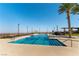Resort-style community pool featuring lap lanes, lounge chairs, and a picturesque desert view at 11161 Black Fire Opal Dr, Las Vegas, NV 89138