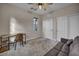 Bedroom has a ceiling fan, window, and includes a sofa and desk at 12283 Lost Treasure Ave, Las Vegas, NV 89138