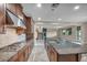Open-concept kitchen featuring stainless steel appliances, granite countertops, and tile flooring at 12283 Lost Treasure Ave, Las Vegas, NV 89138