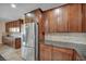 Modern kitchen features stainless steel appliances, granite countertops and a refrigerator at 12283 Lost Treasure Ave, Las Vegas, NV 89138