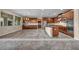 Open kitchen and living space with stainless appliances and tile flooring at 12283 Lost Treasure Ave, Las Vegas, NV 89138