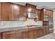 Modern kitchen featuring stainless steel appliances, granite countertops, and custom cabinetry at 12283 Lost Treasure Ave, Las Vegas, NV 89138