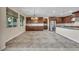 Open kitchen and dining area with stainless steel appliances and dark wood cabinets at 12283 Lost Treasure Ave, Las Vegas, NV 89138
