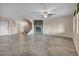 Open floor plan with staircase and stone fireplace in living room at 12283 Lost Treasure Ave, Las Vegas, NV 89138