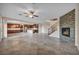 Open concept floor plan with fireplace, kitchen, and staircase at 12283 Lost Treasure Ave, Las Vegas, NV 89138