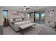 Serene main bedroom with a balcony, large windows, and a sitting area at 12283 Lost Treasure Ave, Las Vegas, NV 89138