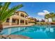 Backyard pool area with palm trees and covered patio in this luxurious two-story home at 12283 Lost Treasure Ave, Las Vegas, NV 89138
