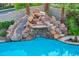 Custom pool features a unique stone water slide at 12283 Lost Treasure Ave, Las Vegas, NV 89138