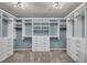 Walk-in closet is equipped with white shelving, cabinets, and drawers for optimal storage and organization at 12283 Lost Treasure Ave, Las Vegas, NV 89138
