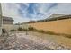 Cozy backyard with gravel, patio and block wall fence at 130 Mountain Cedar Ct, North Las Vegas, NV 89031