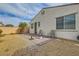 Backyard featuring low-maintenance landscaping and a brick patio with sitting area at 130 Mountain Cedar Ct, North Las Vegas, NV 89031