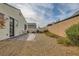 Backyard featuring gravel landscaping and a brick patio with privacy fencing at 130 Mountain Cedar Ct, North Las Vegas, NV 89031
