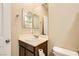 Bathroom featuring vanity, toilet, mirror, and neutral color palette at 130 Mountain Cedar Ct, North Las Vegas, NV 89031