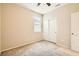 A carpeted bedroom featuring neutral tones, a closet with sliding doors, and a window at 130 Mountain Cedar Ct, North Las Vegas, NV 89031