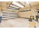 A well-lit two car garage with door open and storage at 130 Mountain Cedar Ct, North Las Vegas, NV 89031
