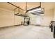Spacious two-car garage featuring storage shelves and ample room for vehicles and projects at 130 Mountain Cedar Ct, North Las Vegas, NV 89031