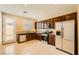 Well-equipped kitchen featuring stainless steel appliances, granite countertops, and ample cabinet space at 130 Mountain Cedar Ct, North Las Vegas, NV 89031