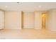 Large living room features tile floors and neutral walls, providing a blank canvas for decorating to your taste at 130 Mountain Cedar Ct, North Las Vegas, NV 89031