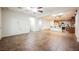 Inviting living room with tile floors, neutral color scheme and seamless flow to the kitchen at 132 Soaring Sky Ave, Henderson, NV 89011