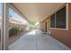 Long covered patio featuring concrete flooring and a view of the backyard at 132 Soaring Sky Ave, Henderson, NV 89011