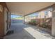 Covered patio providing shade and extending living space outdoors, with concrete flooring at 132 Soaring Sky Ave, Henderson, NV 89011
