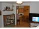 Cozy living room with a view into the kitchen and warm natural wood accents at 1382 N Trout Canyon Rd, Las Vegas, NV 89124