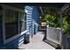 A blue wood-sided house with a charming covered porch and white railing at 1382 N Trout Canyon Rd, Las Vegas, NV 89124