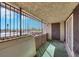 Private balcony features a desert view, security bars, and private door at 1405 Vegas Valley Dr # 312, Las Vegas, NV 89169