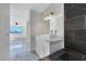 Stylish bathroom includes marble floors, double vanity, a walk in shower, and modern fixtures at 1405 Vegas Valley Dr # 312, Las Vegas, NV 89169