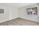 Bright bedroom features modern flooring and a window with bars at 1405 Vegas Valley Dr # 312, Las Vegas, NV 89169