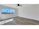 Sunny bedroom offers light wood floors, a modern ceiling fan, and a bright window view at 1405 Vegas Valley Dr # 312, Las Vegas, NV 89169