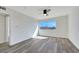 Spacious bedroom with light wood floors, a ceiling fan, and a large window for ample light at 1405 Vegas Valley Dr # 312, Las Vegas, NV 89169