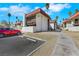 Apartment building shows off a red car parked alongside a two story complex in a desert setting at 1405 Vegas Valley Dr # 312, Las Vegas, NV 89169