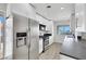 Modern galley kitchen features stainless steel appliances, updated cabinetry, and modern lighting at 1405 Vegas Valley Dr # 312, Las Vegas, NV 89169