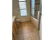 Bright bathroom featuring tiled floors, large window, and a shower over tub with glass doors at 149 Cologne Ct, Henderson, NV 89074