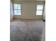 Bedroom with carpet flooring and two windows, providing plenty of natural light at 149 Cologne Ct, Henderson, NV 89074