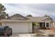 Charming single-story home with a two car garage and well-maintained front yard at 149 Cologne Ct, Henderson, NV 89074