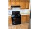 Well-lit kitchen with gas range, tiled countertop, and cabinets with tiled flooring at 149 Cologne Ct, Henderson, NV 89074