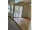 Living room with tile flooring and view of backyard pool through the sliding glass door at 149 Cologne Ct, Henderson, NV 89074