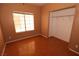 Bedroom featuring laminate wood floors, natural light, and ample closet space, perfect for relaxing at 1900 N Torrey Pines Dr # 225, Las Vegas, NV 89108
